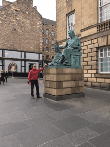 John poses with the monument to philosopher David Hume